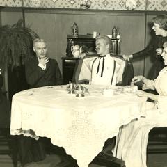 Alpha Psi Omega - Performing a play onstage, dining room scene