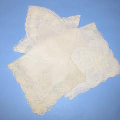 Three ivory lace handkerchiefs