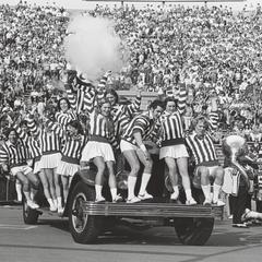 UW cheerleaders ride the Bucky Wagon