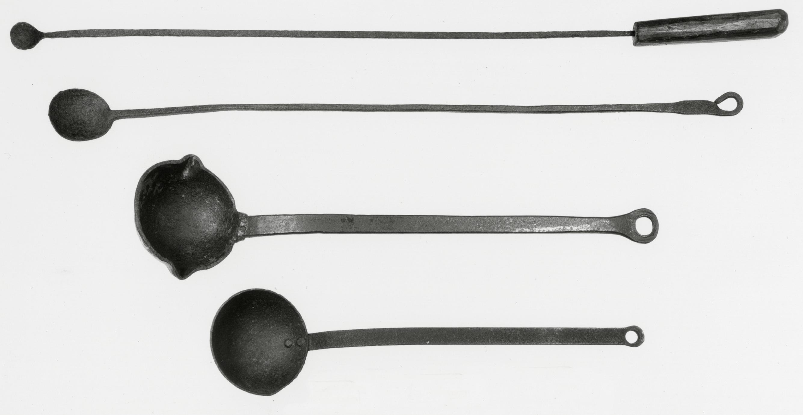 Black and white photograph of melting and pouring ladles.