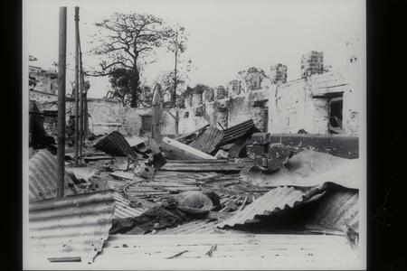 Dead Filipino amid ruins, 1945
