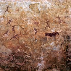 Petroglyph : Humans Armed with Bows and Long-Horned Sheep Below