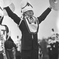 Marching band member with cymbals