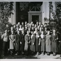 Manual Arts Players group photograph in front of Home Economics Building