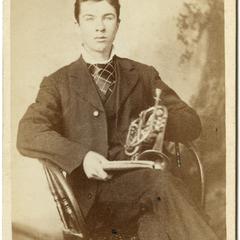 Seated man with cornet