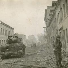 Tank rolls down the trashed streets of Magdeburg