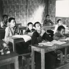Akha students seated in a classroom in Houa Khong Province