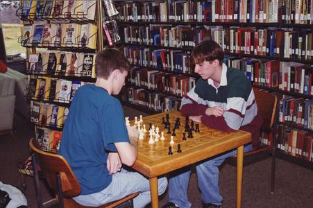 Two students playing chess, Janesville, ca. 1990