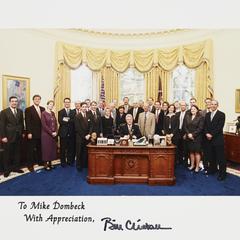 White House Oval Office photo of administrators with President Bill Clinton