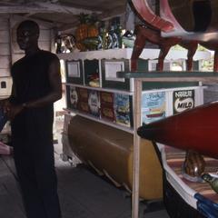 Man in garage with sculptures