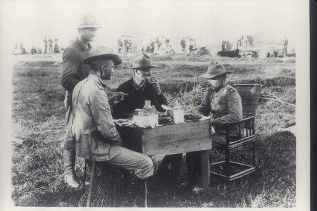 General Funston and aides take a meal in the field, early 1900s