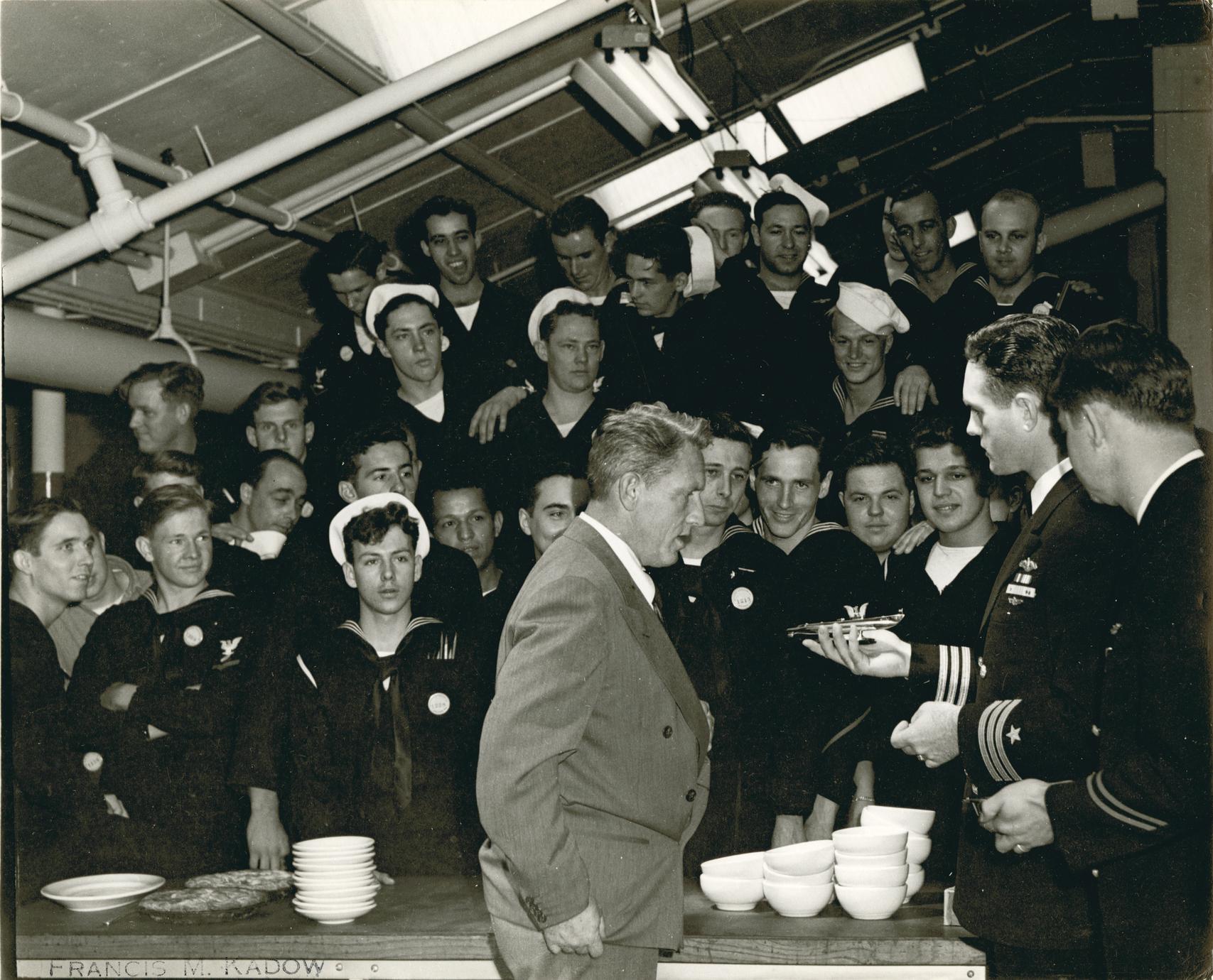 Spencer Tracy in mess hall with commander and crew of submarine Icefish