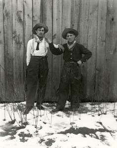 Two boys dressed like cowboys
