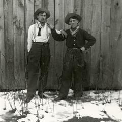 Two boys dressed like cowboys