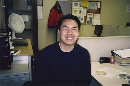 Male student sitting at desk