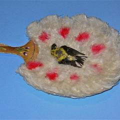 White feather fan with splashes of rose dye