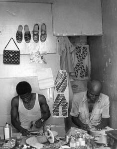 Two Shoemakers at Work