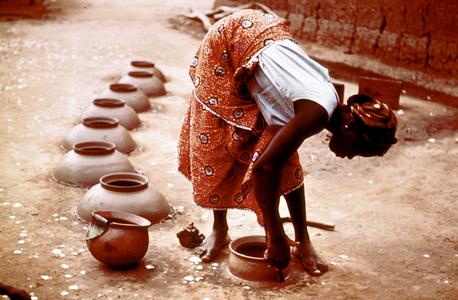 Woman Making Water Pots