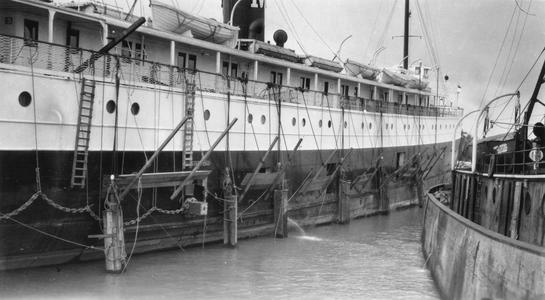 The Manitou aground in Saint Marys River, side view with hanging ladders