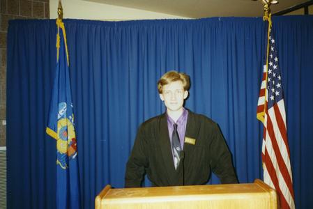 Stout Student Association, Chip Orlikowski standing at podium