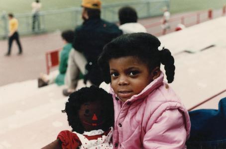 African American girl with doll