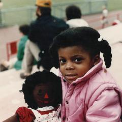 African American girl with doll
