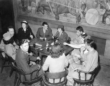 Military personnel around a table