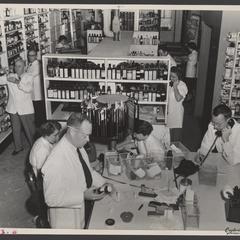 Busy pharmacy staff at work
