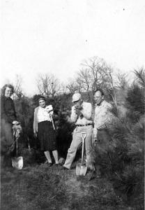 Nina, Estella, Aldo, and Frederick Leopold planting pines