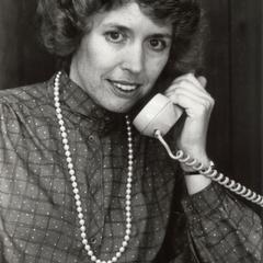 Dean Nancy Aumann on the telephone