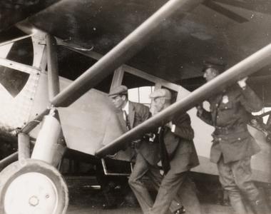 Men pushing Lindbergh's plane