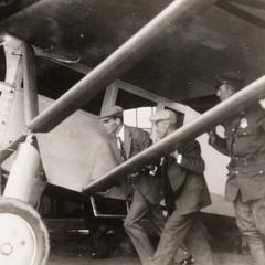 Men pushing Lindbergh's plane