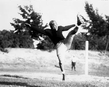 Walter "Mickey" McGuire punting.