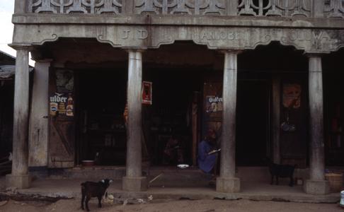 Mrs. Olyemi's shop with people and goat