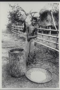 Peasant pounding rice, early 1900s