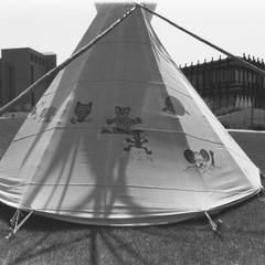 Teepee on lawn in front of the Library Learning Center and College of Community Sciences building