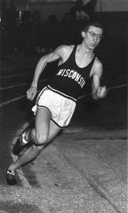 Don Gehrmann running an indoor race.