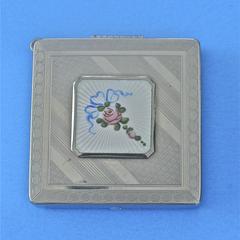 Dancing compact with enamel rose