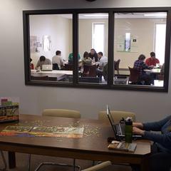 College students utilizing study rooms