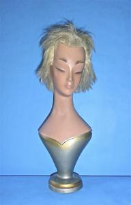 Bust and head with silver painted bodice and round base