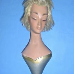 Bust and head with silver painted bodice and round base