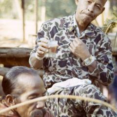 District Chief Tong drinks hot tea in Nam Nga, in Attapu Province