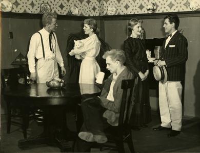 Alpha Psi Omega - Performing a play onstage, dining room scene