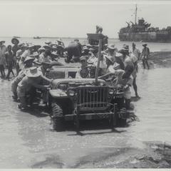 Filipinos push jeep, Panay, 1945