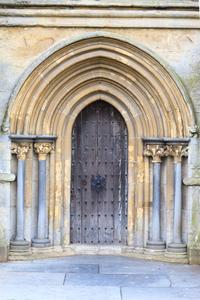 Wells Cathedral exterior west facade nave aisle door