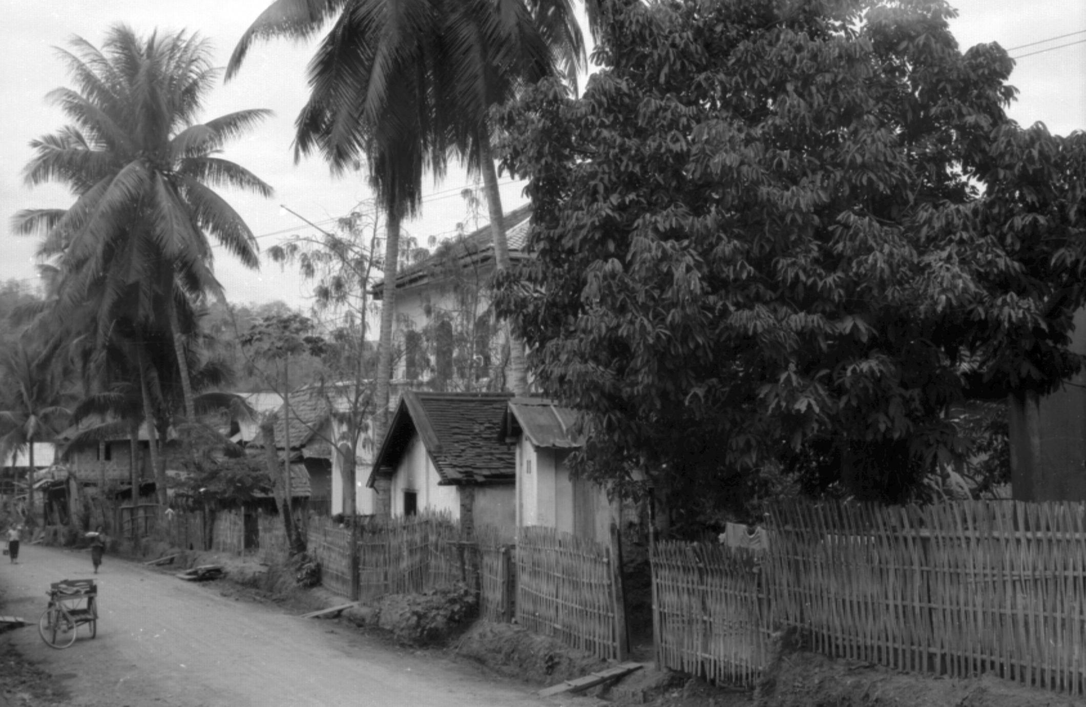 View of JMH residence on side of street, Mekong River bottom of the street