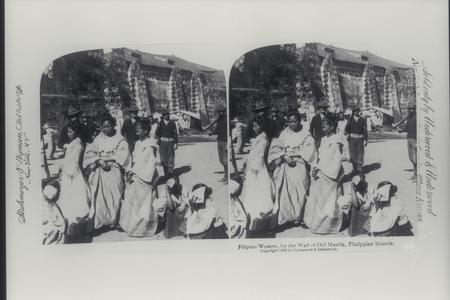 Filipino women and American soldiers by wall of Old Manila, Intramuros, ca. 1899