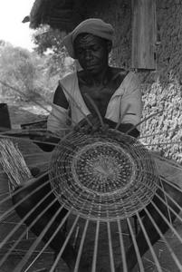 Man Weaving Basket