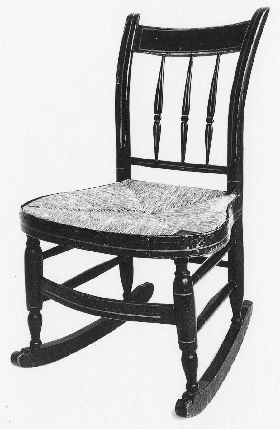 Black and white photograph of a child's rocking side chair.