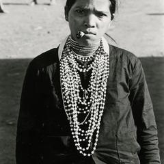 A Nyaheun woman smokes a homemade cigarette in Attapu Province